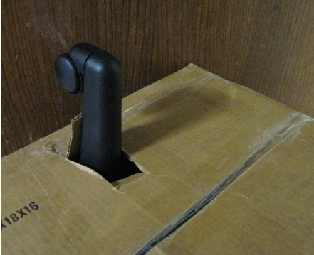 box with office chair leg sticking out